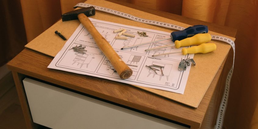 From above of wooden cabinet with drawers and paper instruction with tool to assemble it — 6 Ways to Meet Single Men