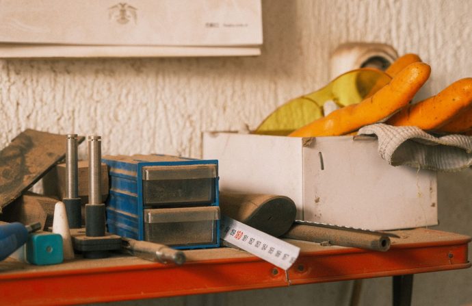 Collection of vintage tools on a wooden table indoors with a retro vibe. — Advertising Insights