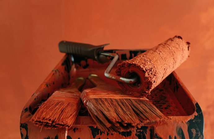 Orange paint tools in a messy tray, perfect for renovation themes. — Choosing a VDR Service provider