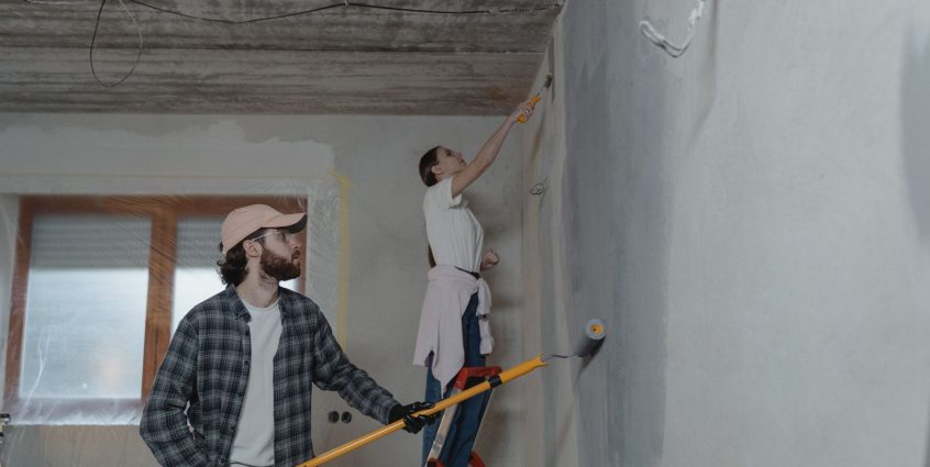 A couple painting a room together, highlighting teamwork in home renovation. — ChristianMingle Assessment for 2021: Would It
