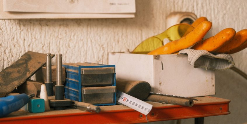 Collection of vintage tools on a wooden table indoors with a retro vibe. — Demystifying ISO Training: Gaining the Skills to I