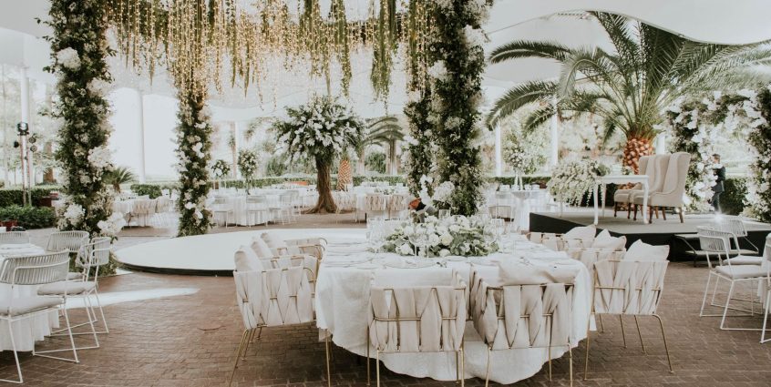Stunning outdoor wedding setup featuring floral decorations, elegant seating, and ambient lighting. — DIY Wood Panelling Idea