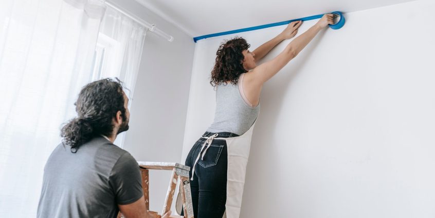 A couple collaborates to tape and paint a room during a home improvement project. — Ordinarily Made Errors When Writing An Es