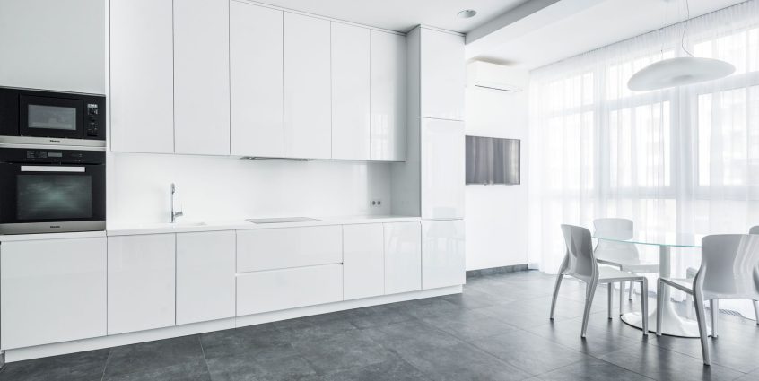 Sleek white kitchen with modern appliances and minimalist design. — Stylish and Durable Carpets Maidstone Collections for Eve