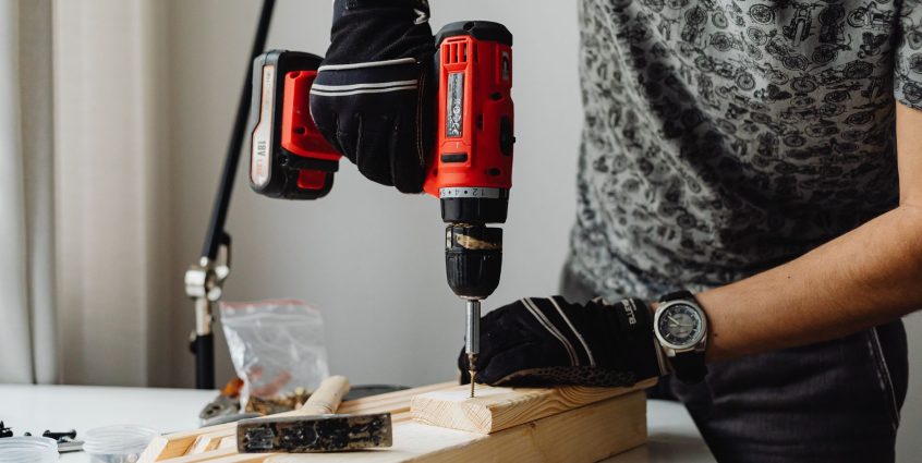 A skilled craftsman working on a wooden piece using a power drill, showcasing precision and expertise. — The biggest launch o