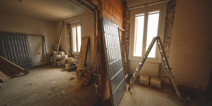 Interior view of a room under renovation with construction materials and a ladder. — The Importance of Professionalism in Out